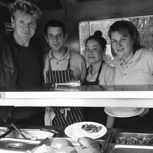 Gordon Ramsay joins Jamie Cook and Fayre Do's in the food truck on set.