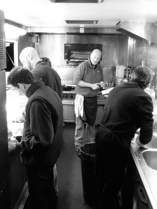 Jamie Cook with the Fayre Do's catering staff preparing meals in the food truck.